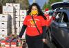 Credit: KUOW Photo/Juan Pablo Chiquiza Roxana Pardo Garcia, cofounder of Alimentado el Pueblo, poses for a portrait outside Lake Burien Presbyterian Church, December 14, 2020